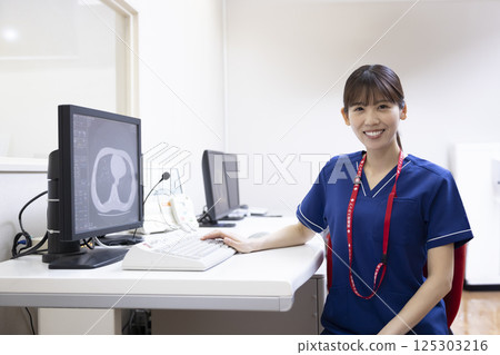A radiologist looks at the results of a CT scan on a monitor. Photo courtesy of Denpa Gakuen, Tokyo Electronics College. A radiologist looks at the results of a CT scan on a monitor. Photo courtesy of Denpa Gakuen, Tokyo Electronics College. 125303216