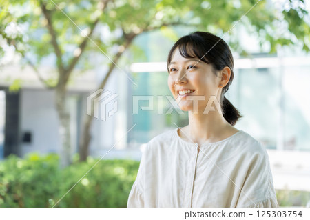 Japanese woman among fresh greenery Generative AI 125303754