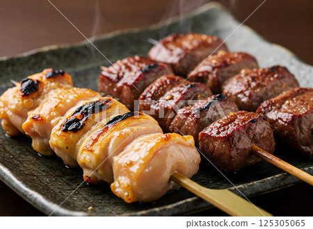 Yakitori and beef skewers on a plate Yakitori and beef skewers on a plate 125305065