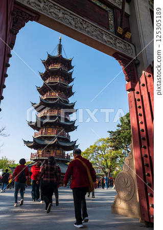 Chinese people walk through gate to Longhua pagoda, Shanghai, China 125305189