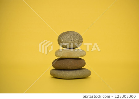 Stacked pebbles (yellow background material) 125305300