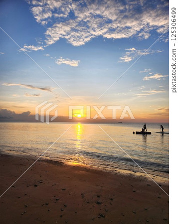 Malaysia: Sunset and gentle waves over the ocean at Tioman Island Malaysia: Sunset and gentle waves over the ocean at Tioman Island 125306499