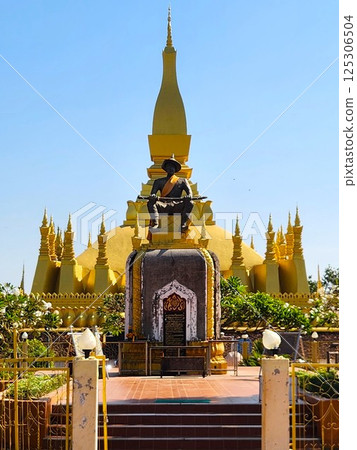 Laos: Statue of King Setthathirat standing in front of That Luang Laos: Statue of King Setthathirat standing in front of That Luang 125306504
