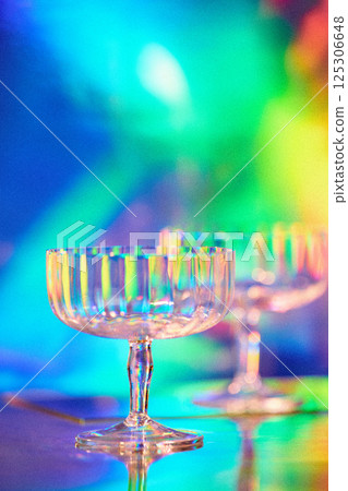 empty glasses on colorful neon lights background 125306648