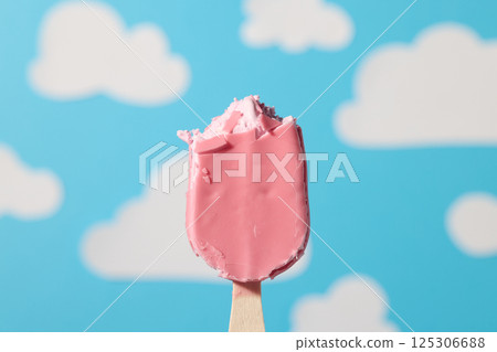 pink ice cream bar on wooden stick pink ice cream bar on wooden stick 125306688