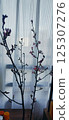 peach flowers arranged in a vase 125307276