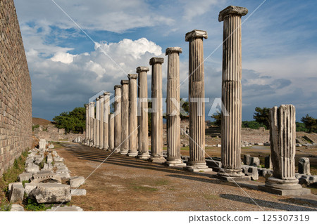 Exploring the ancient columns of the Asklepion Heroon in Bergama, Izmir, Turkey on a clear day 125307319