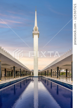 Majestic view of the minaret at the National Masjid of Malaysia in Kuala Lumpur during sunset Majestic view of the minaret at the National Masjid of Malaysia in Kuala Lumpur during sunset 125307321