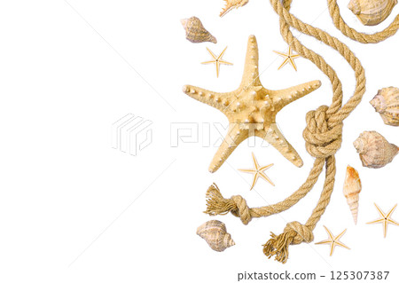 Beach items arranged with a starfish and shells for summer, isolated on white Beach items arranged with a starfish and shells for summer, isolated on white 125307387