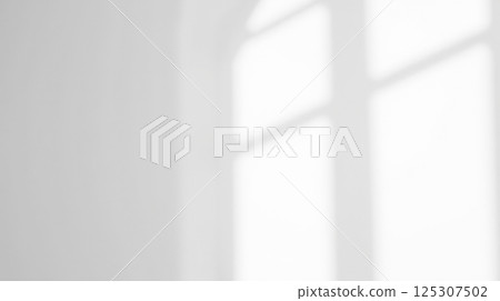 Bright natural sunlight and soft shadows falling on clean white background through window, minimalist design projects and artistic creativity Bright natural sunlight and soft shadows falling on clean white background through window, minimalist design projects and artistic creativity 125307502