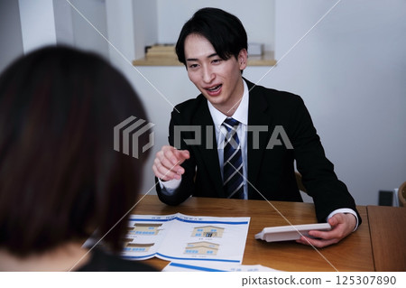 The image of unscrupulous salespeople forcing people into signing contracts 125307890