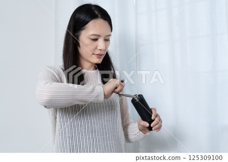 磨豆子的女人 125309100