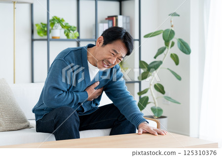 Middle-aged man with chest pain Middle-aged man with chest pain 125310376