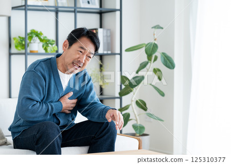 Middle-aged man with chest pain Middle-aged man with chest pain 125310377