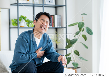 Middle-aged man with chest pain Middle-aged man with chest pain 125310378
