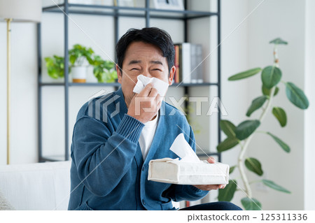 Middle-aged man with hay fever 125311336