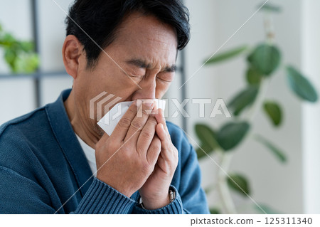 Middle-aged man with hay fever Middle-aged man with hay fever 125311340