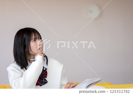 Female student to think 125311782