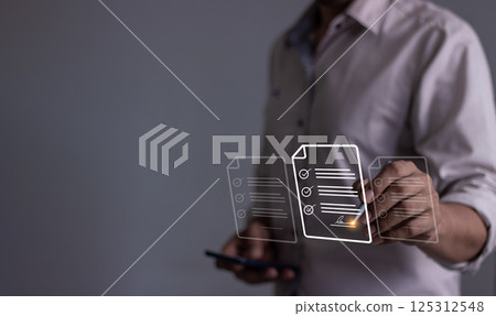 Young man with smartphone mobile hand using a pen touching to sign a Online Business Contract Young man with smartphone mobile hand using a pen touching to sign a Online Business Contract 125312548