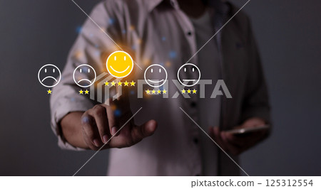 Young Man with Smart Phone hand touching five star to review and give 5 stars 125312554