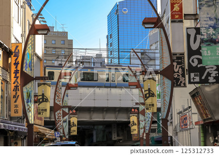 Urban Street Scene with Elevated Train and Vibrant Signs Dec 9 2024 Urban Street Scene with Elevated Train and Vibrant Signs Dec 9 2024 125312733
