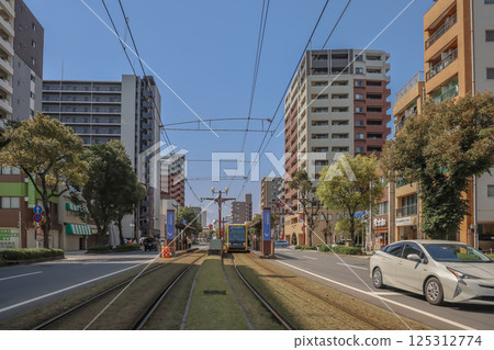 March 23 2025 Urban Street Intersection with Tram and Modern Architecture March 23 2025 Urban Street Intersection with Tram and Modern Architecture 125312774