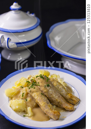 rabbit with cream sauce and mashed potatoes 125313810