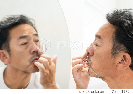 Middle-aged man doing skin care Beauty image Middle-aged man doing skin care Beauty image 125313972