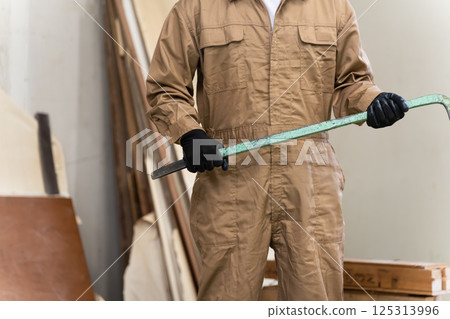 Middle-aged man working at a construction site Middle-aged man working at a construction site 125313996
