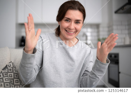 Happy Smiling Girl At Home Showing Size With Hands Happy Smiling Girl At Home Showing Size With Hands 125314617