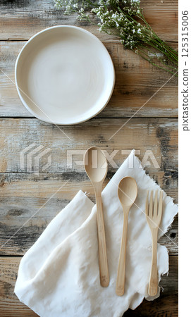 Compostable plate positioned on a rustic wooden table for contrast 125315006