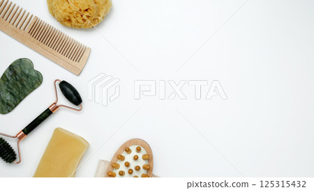 Embodying a sustainable self-care concept. Eco-friendly beauty essentials, marble face roller 125315432