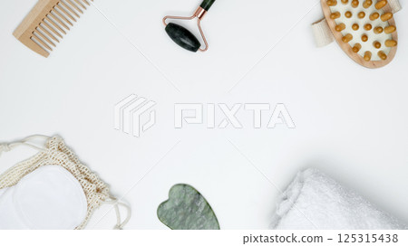 Sustainable self-care concept. Eco-friendly beauty products: massage brush, marble roller, towel, reusable cotton pads Sustainable self-care concept. Eco-friendly beauty products: massage brush, marble roller, towel, reusable cotton pads 125315438