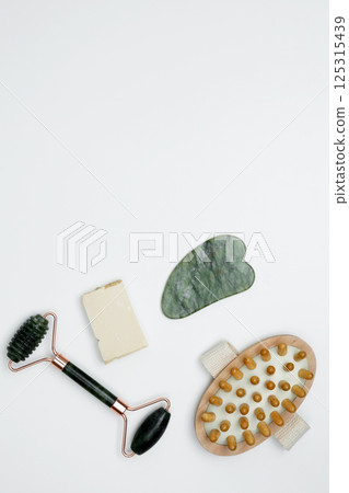 Embodying a sustainable self-care concept. Eco-friendly beauty essentials, marble face roller 125315439