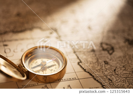 Compass with vintage map 125315643