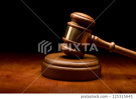 Wooden gavel on brown background 125315645