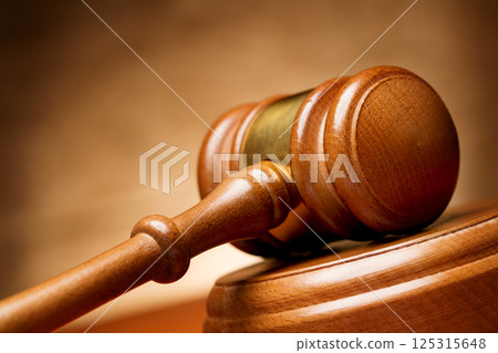 Wooden gavel on brown background 125315648