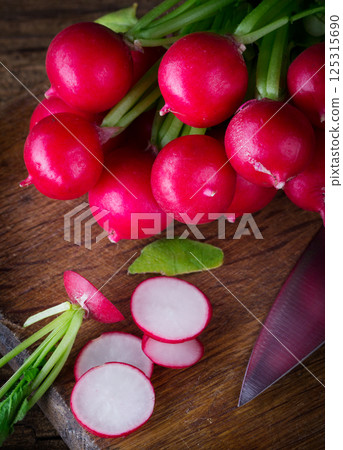 Fresh red radish and kitchen board Fresh red radish and kitchen board 125315690