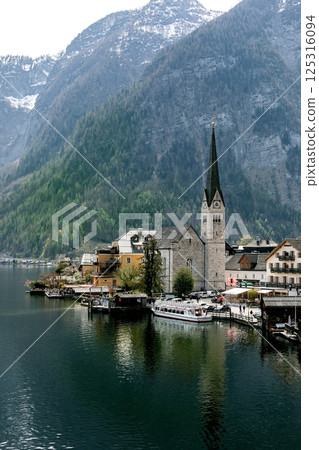 Hallstatt Church By Alpine Mountain Lake 125316094