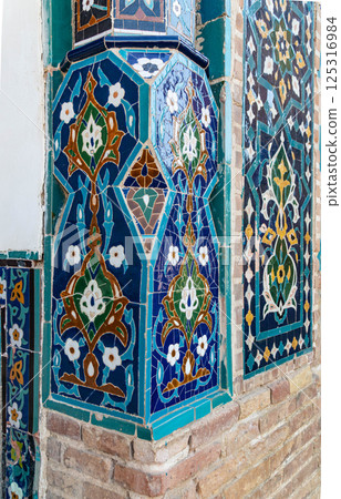Traditional art of Uzbekistan - pattern of colored tiles on the walls of the mausoleum Gur-Emir 125316984
