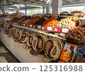 Display case with colorful nuts and dried fruits at a traditional oriental bazaar in Samarkand 125316988