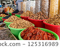 Display case with colorful nuts and dried fruits at a traditional oriental bazaar in Samarkand 125316989