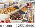 Display case with colorful nuts and dried fruits at a traditional oriental bazaar in Samarkand 125316990
