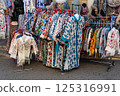 National Uzbek chapan clothes in the window of a market in Samarkand, Uzbekistan 125316991