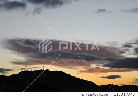 Sunset sky, steel towers and radio towers Sunset sky, steel towers and radio towers 125317349