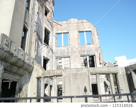 The Atomic Bomb Dome, also known as the Hiroshima Peace Memorial, is an atomic bomb-damaged structure located in Hiroshima City, Hiroshima Prefecture, that conveys the tragedy of the atomic bomb. 125318026