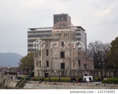 The Atomic Bomb Dome, also known as the Hiroshima Peace Memorial, is an atomic bomb-damaged structure located in Hiroshima City, Hiroshima Prefecture, that conveys the tragedy of the atomic bomb. The Atomic Bomb Dome, also known as the Hiroshima Peace Memorial, is an atomic bomb-damaged structure located in Hiroshima City, Hiroshima Prefecture, that conveys the tragedy of the atomic bomb. 125318065