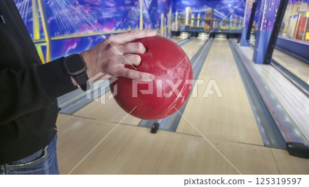 Sports hall for bowling. Pin lanes and colorful balls. Family recreation. Sports hall for bowling. Pin lanes and colorful balls. Family recreation. 125319597