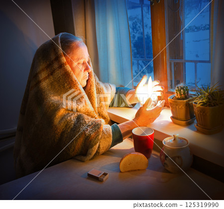 Woman with candles. Power outage in Kyiv 125319990