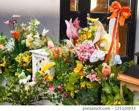 Easter floral arrangement decorating a window box Easter floral arrangement decorating a window box 125320033